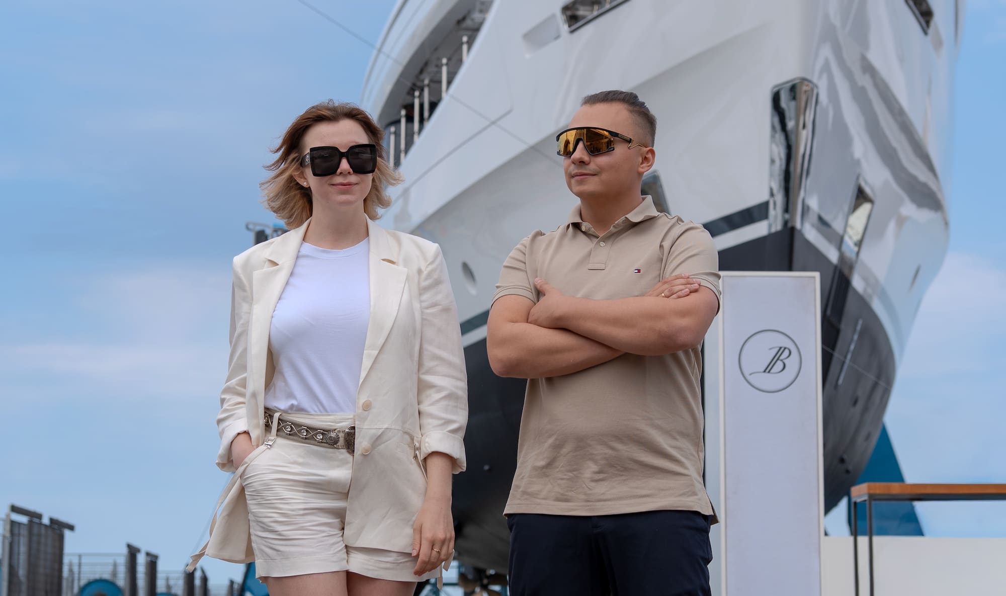 The Mare Port Digital team on the dock in front of a Benetti superyacht