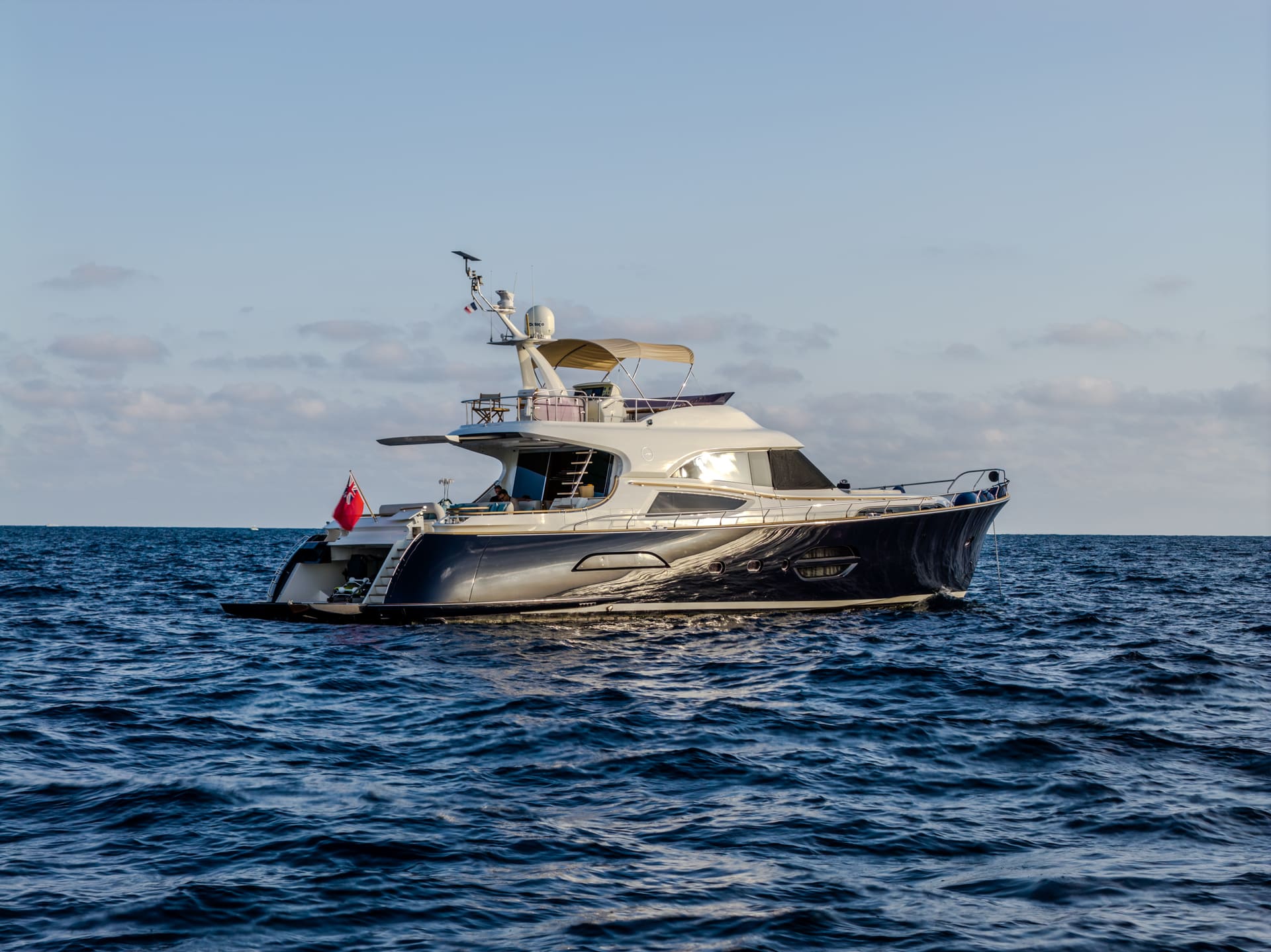 Mochi Craft Dolphin 74 Contango, port bow profile in open water