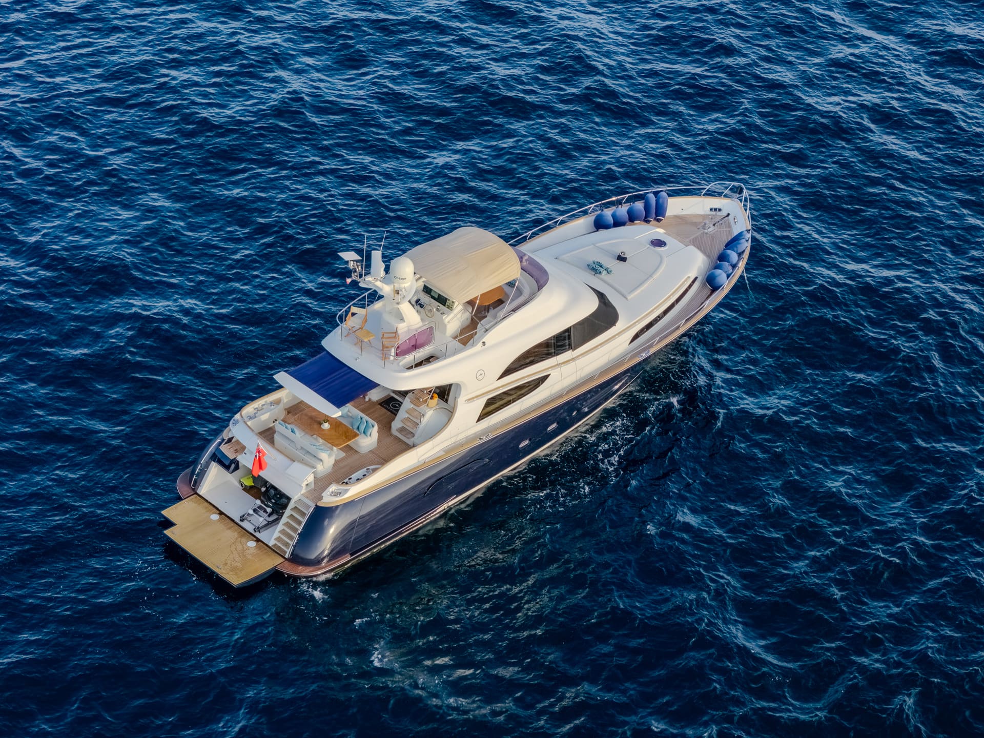 Mochi Craft Dolphin 74 Contango, aerial view of the port side with the bathing platform lowered