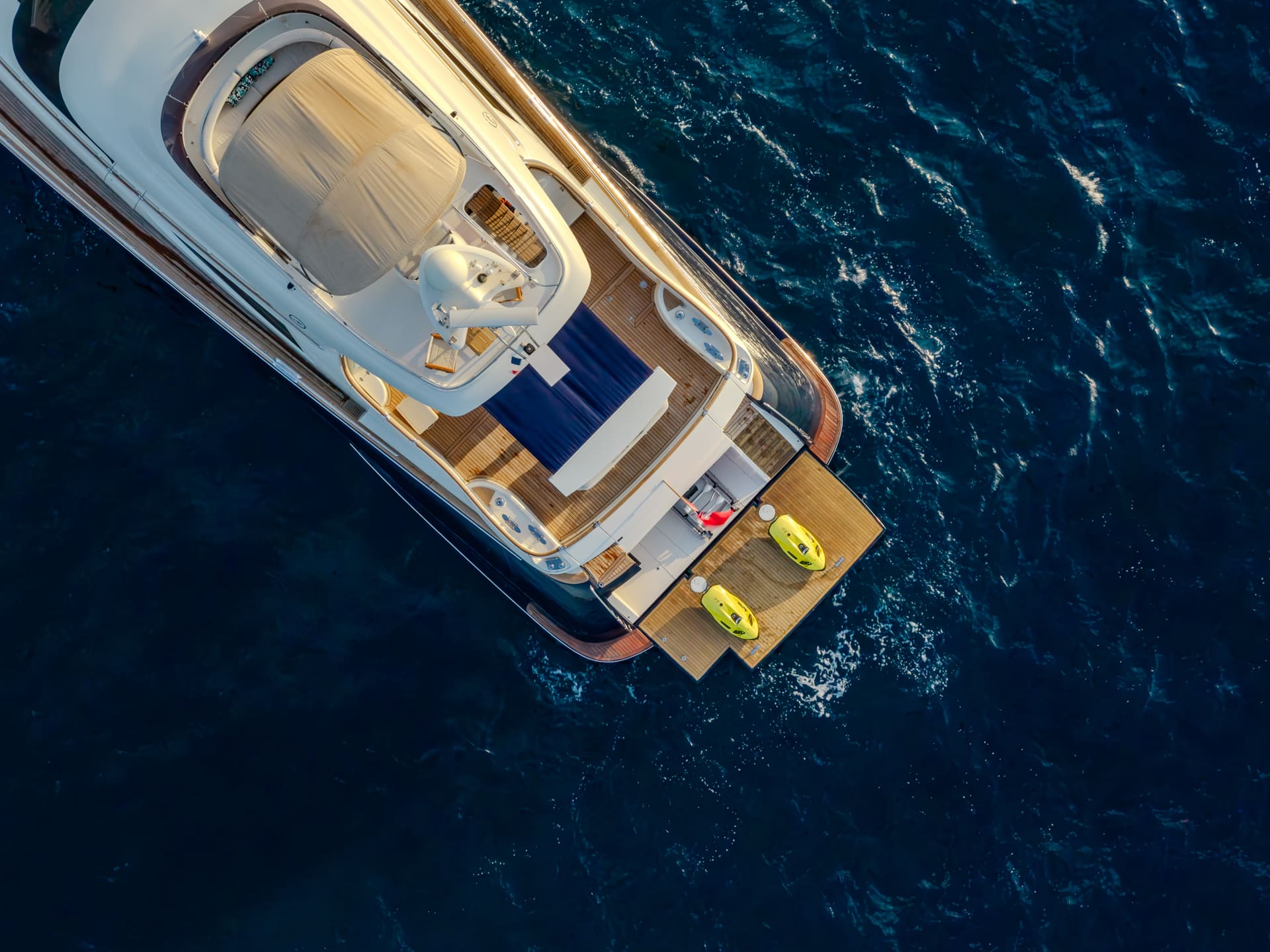 Mochi Craft Dolphin 74 Contango, overhead aerial of the bathing platform and water toys