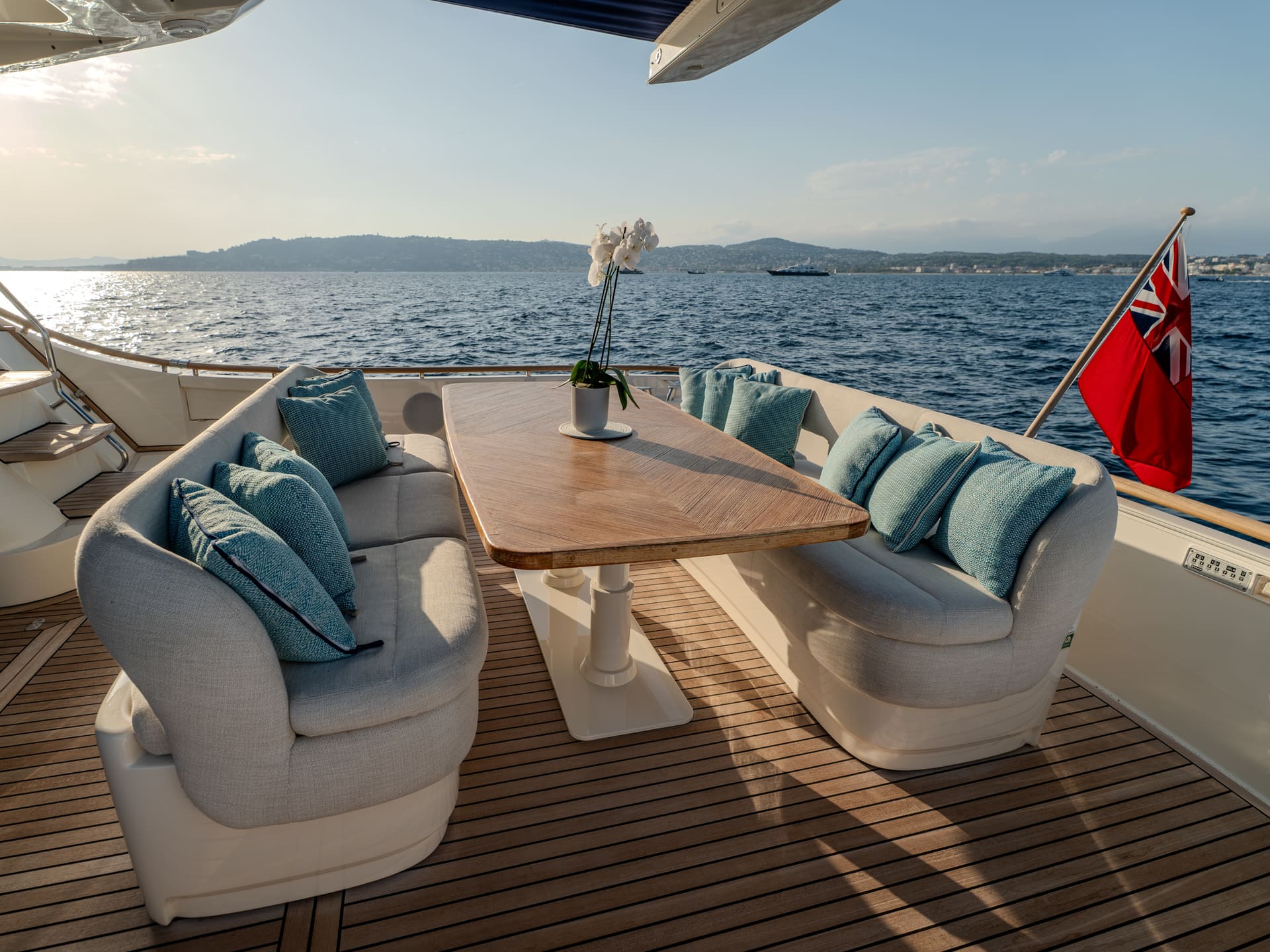 Mochi Craft Dolphin 74 Contango, aft deck dining table and armchair seating