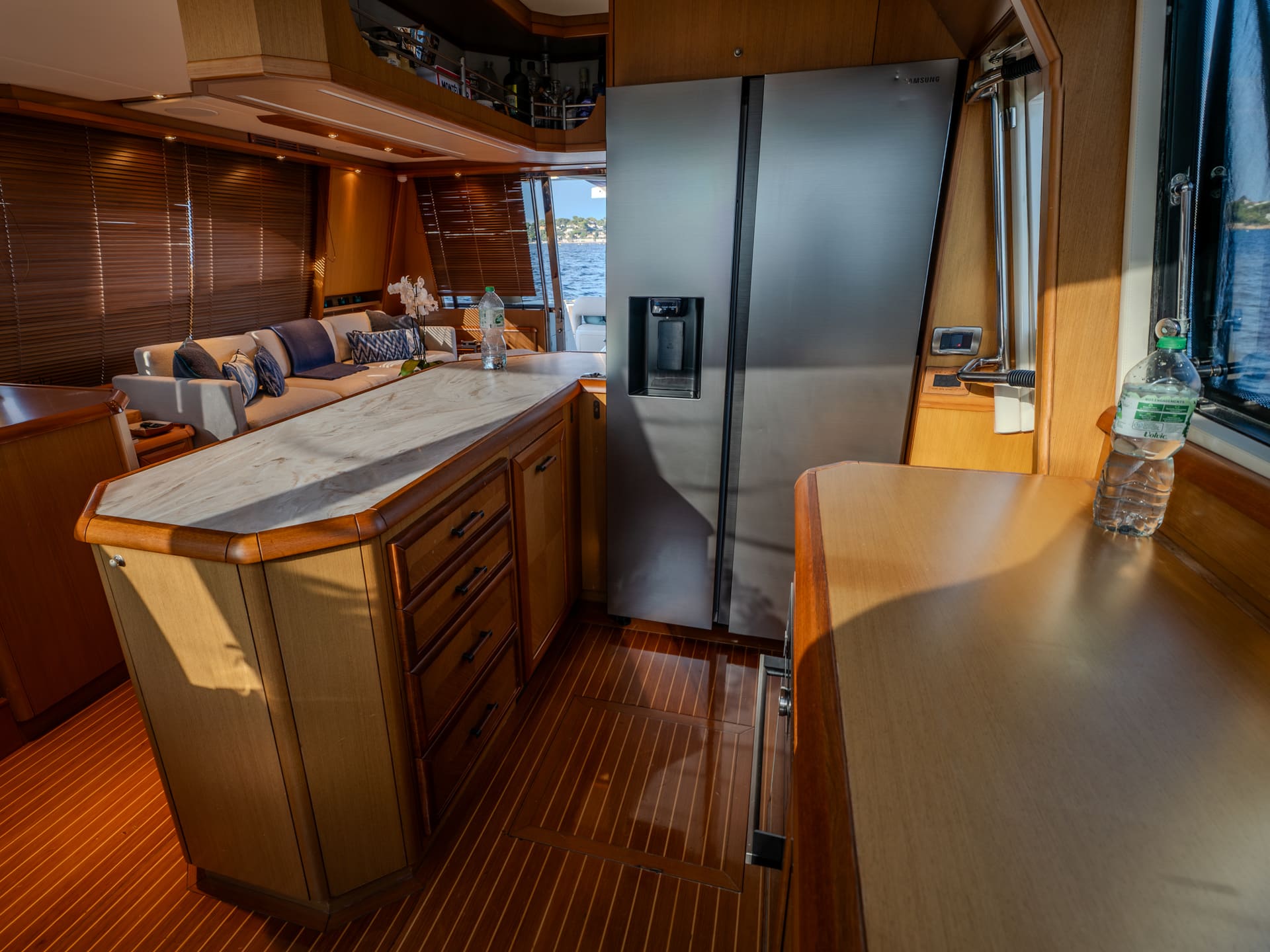 Mochi Craft Dolphin 74 Contango, galley with a marble counter and a full height fridge