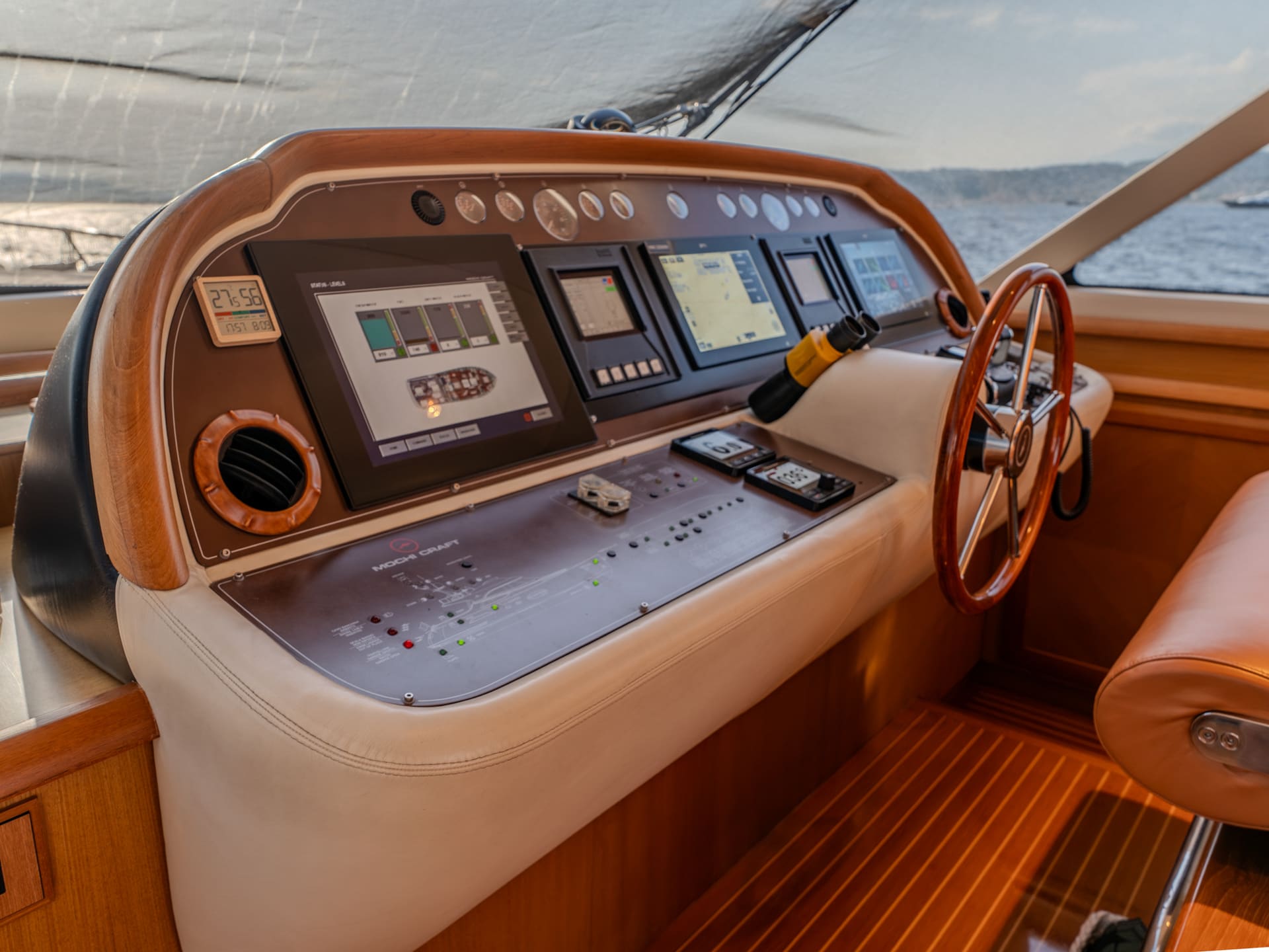 Mochi Craft Dolphin 74 Contango, main deck helm console, wheel and instruments