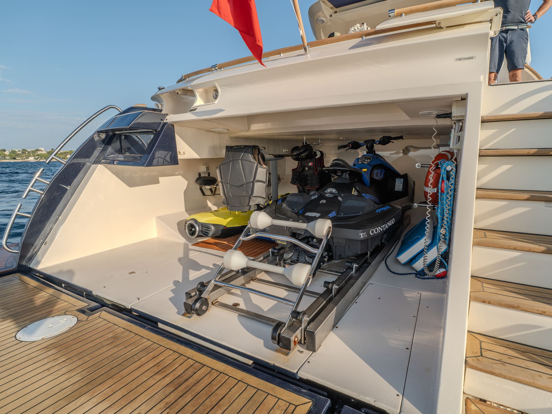 Mochi Craft Dolphin 74 Contango, transom garage with a jet ski and a Seabob