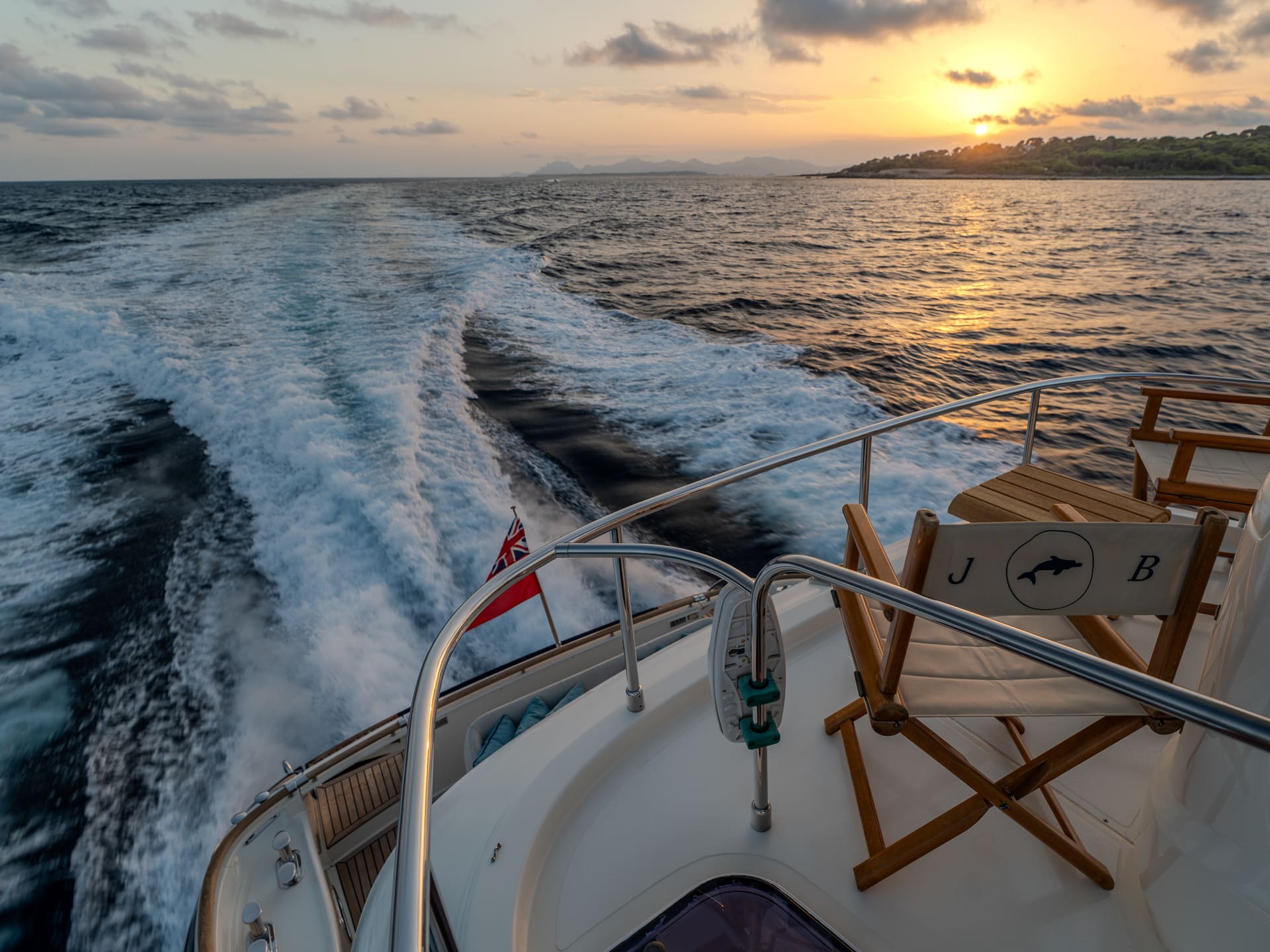 Mochi Craft Dolphin 74 Contango, wake at sunset seen from the aft deck